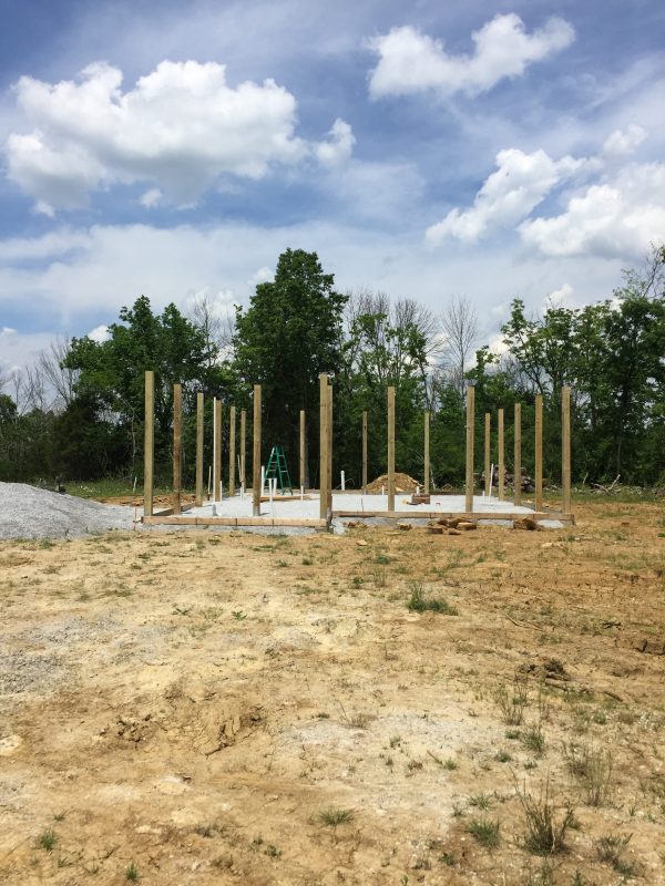 Posts in place on our DIY pole frame for a cordwood house