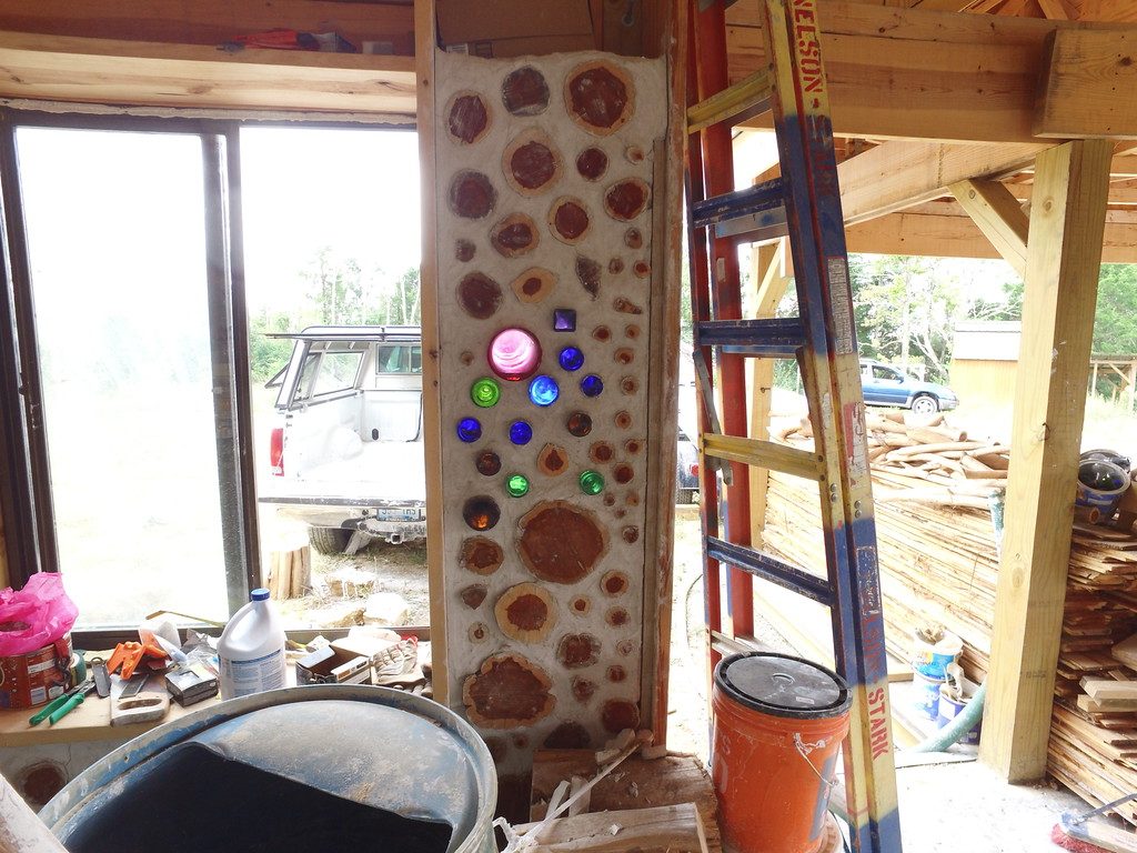 What bottle ends look like on the inside of a cordwood wall - Looking from our hill at Big Muddy Rock - accidentalhippies.com