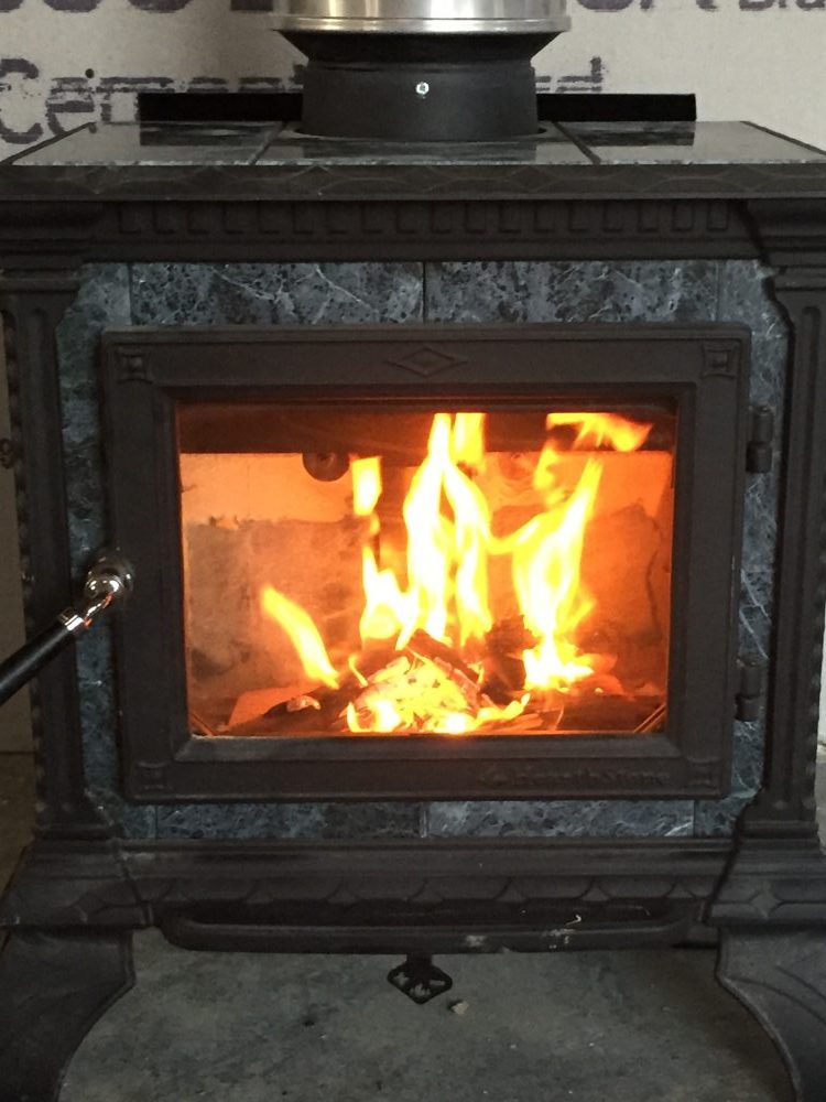 Burning in our soapstone wood stove is one of the many tasks we completed during this phase of our home build. Learn more in our progress reports!