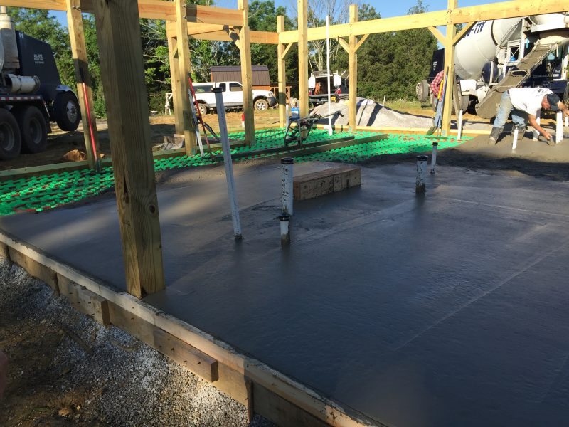 Pouring the concrete slab for a cordwood house